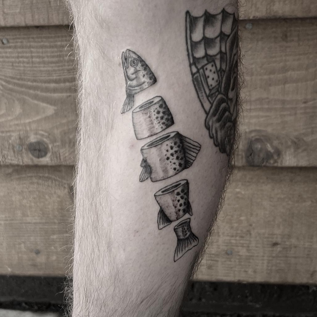 Black-and-gray stipple-shaded trout tattoo sliced into cross-sections down the calf